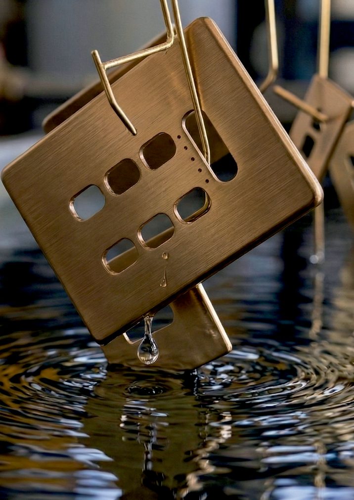 Noir Brass keypad in warm light